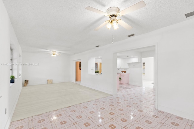 5706 NW 81st Ave, Tamarac, FL 33321 - empty room featuring ceiling fan, a textured ceiling, and baseboards