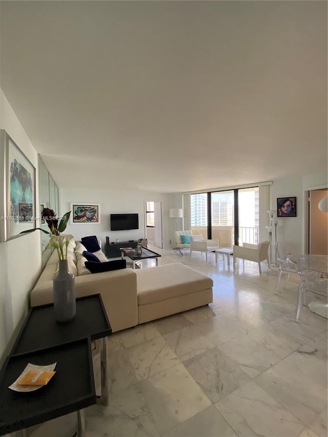 living room featuring light marble finish floors