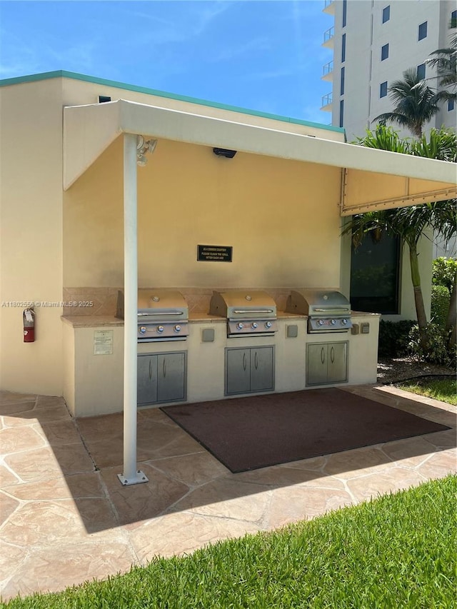view of patio featuring a grill and an outdoor kitchen