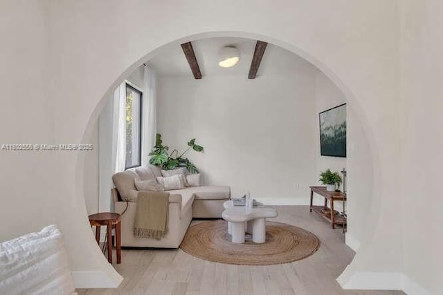 4228 NW 3rd Ave, Miami, FL 33127 - living area featuring beam ceiling, arched walkways, and baseboards