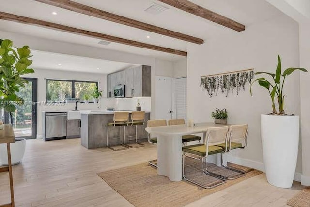 4228 NW 3rd Ave, Miami, FL 33127 - dining area with light wood-style flooring, beamed ceiling, recessed lighting, and baseboards