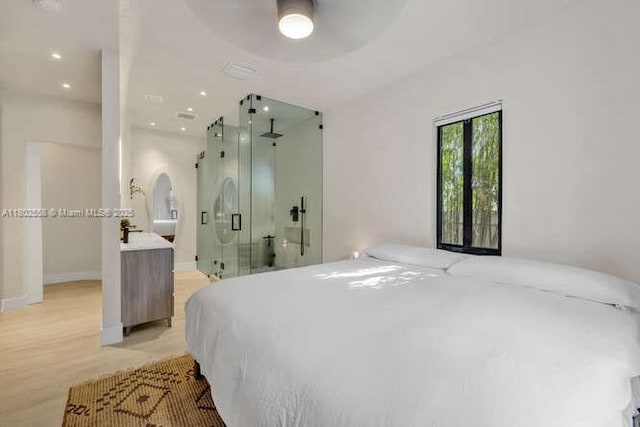 4228 NW 3rd Ave, Miami, FL 33127 - bedroom with light wood-style floors, ceiling fan, and baseboards