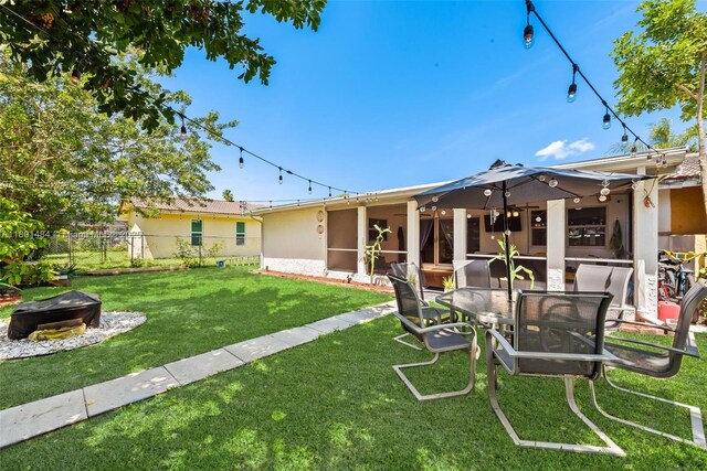 2426 NW 91st Ave, Coral Springs, FL 33065 - view of yard with an outdoor fire pit