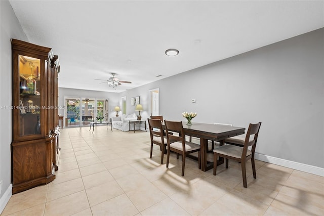 2426 NW 91st Ave, Coral Springs, FL 33065 - dining space featuring light tile patterned flooring, ceiling fan, and baseboards