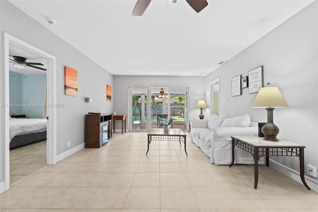 2426 NW 91st Ave, Coral Springs, FL 33065 - living room with ceiling fan, light tile patterned flooring, and baseboards