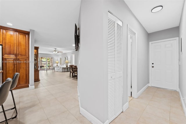 2426 NW 91st Ave, Coral Springs, FL 33065 - hall featuring light tile patterned flooring and baseboards
