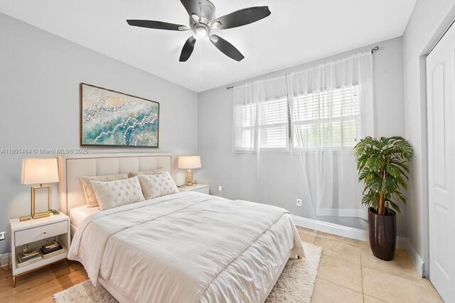 2426 NW 91st Ave, Coral Springs, FL 33065 - bedroom with baseboards, a ceiling fan, and light tile patterned flooring