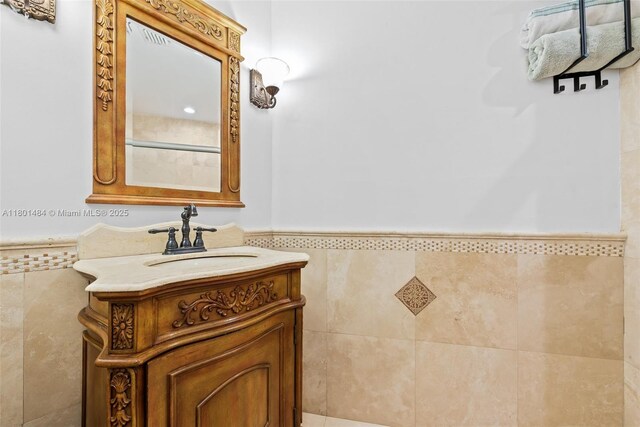 2426 NW 91st Ave, Coral Springs, FL 33065 - bathroom with tile walls, vanity, and a wainscoted wall