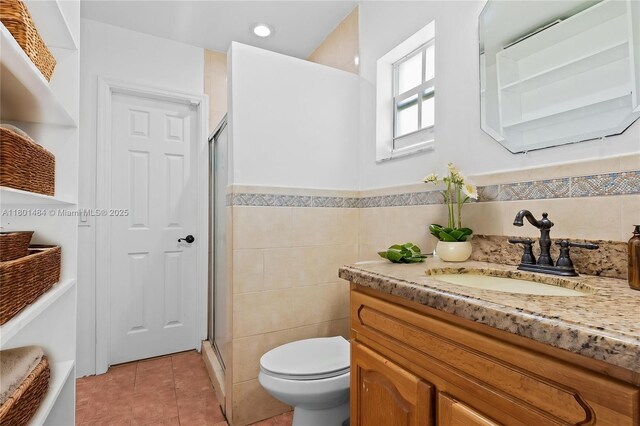 2426 NW 91st Ave, Coral Springs, FL 33065 - bathroom with a stall shower, tile patterned flooring, toilet, vanity, and tile walls