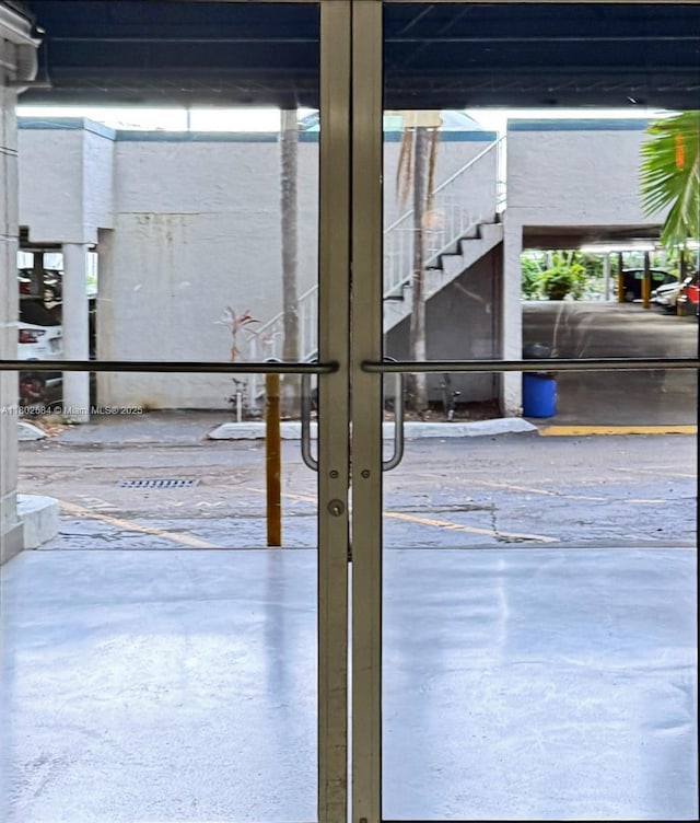 1720 NW N River Dr Unit 203, Miami, FL 33125 - view of patio / terrace featuring french doors and stairs
