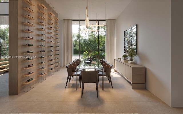 dining room featuring plenty of natural light and a wall of windows