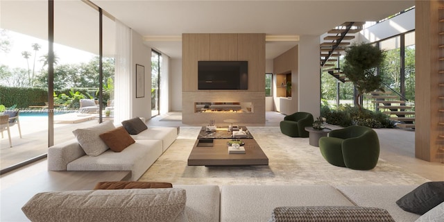 living area featuring a large fireplace and plenty of natural light