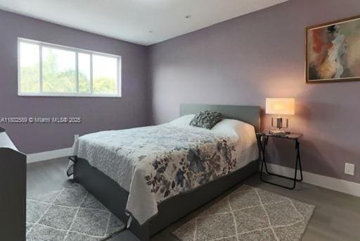 581 Blue Heron Dr Unit 318-B, Hallandale Beach, FL 33009 - bedroom with baseboards