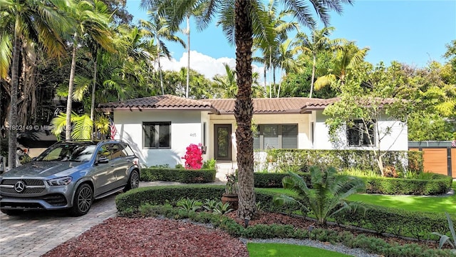 465 NE 52nd St, Miami, FL 33137 - mediterranean / spanish house with stucco siding and a tiled roof