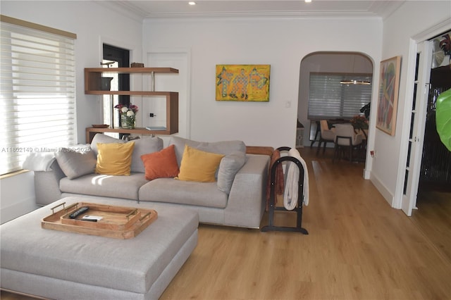 465 NE 52nd St, Miami, FL 33137 - living area with light wood-style floors, arched walkways, crown molding, and recessed lighting