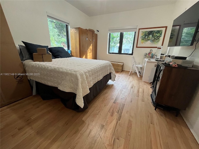 465 NE 52nd St, Miami, FL 33137 - bedroom featuring light wood-style flooring and multiple windows