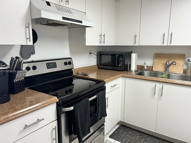 3300 NE 192nd St Unit 803, Aventura, FL 33180 - kitchen with electric range, under cabinet range hood, a sink, and white cabinetry