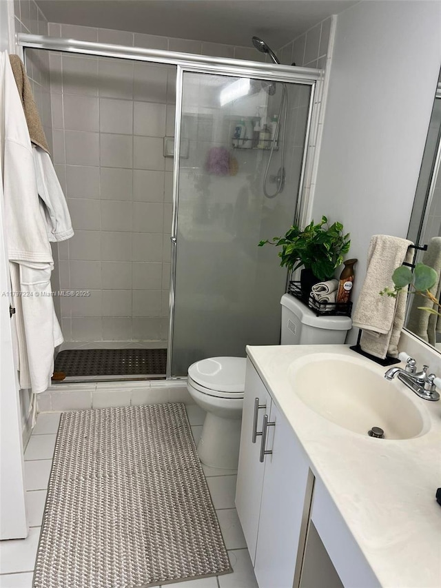3300 NE 192nd St Unit 803, Aventura, FL 33180 - bathroom with tile patterned flooring, a stall shower, toilet, and vanity