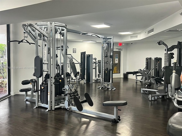 3300 NE 192nd St Unit 803, Aventura, FL 33180 - exercise room featuring wood finished floors and baseboards