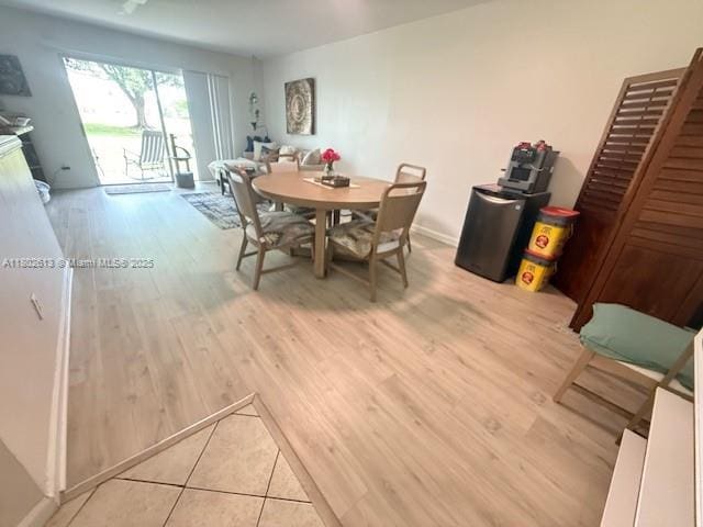 3437 NW 44th St Unit 101, Oakland Park, FL 33309 - dining room with light wood-style floors and baseboards