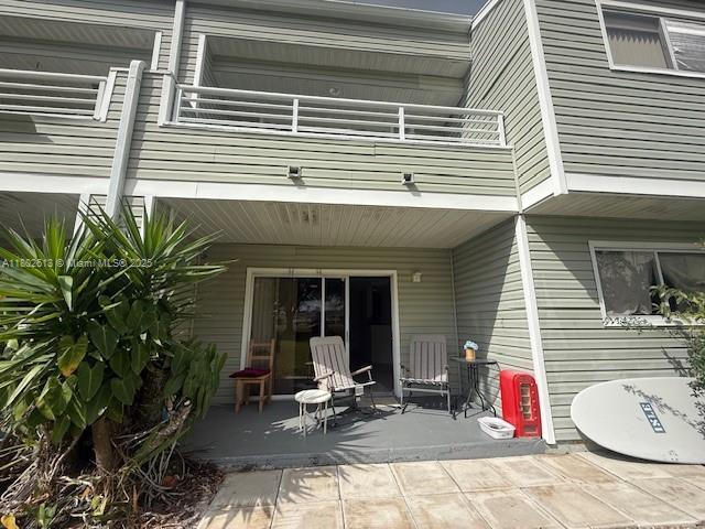 3437 NW 44th St Unit 101, Oakland Park, FL 33309 - back of property featuring a balcony and a patio area
