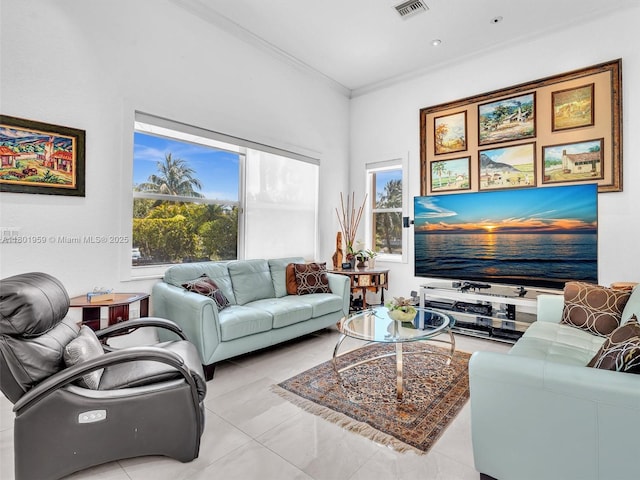 3230 SW 194th Ter, Miramar, FL 33029 - living area with healthy amount of natural light, ornamental molding, and tile patterned floors
