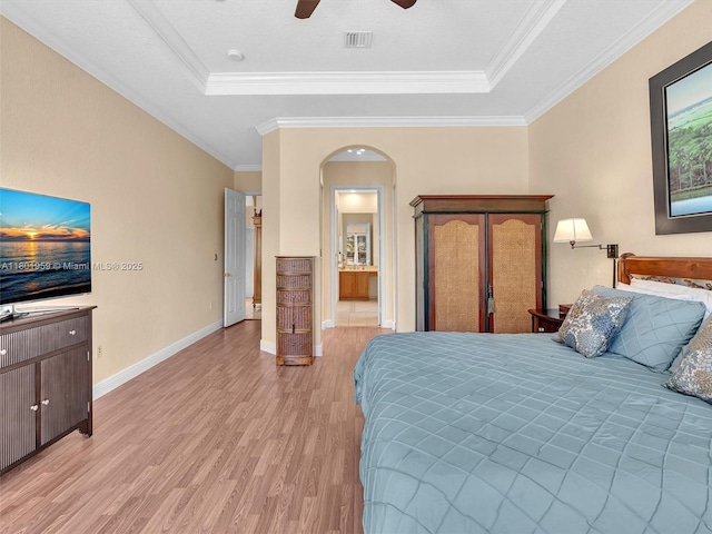 3230 SW 194th Ter, Miramar, FL 33029 - bedroom with a raised ceiling, light wood finished floors, arched walkways, ornamental molding, and a ceiling fan