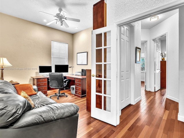 3230 SW 194th Ter, Miramar, FL 33029 - office featuring a textured wall, a ceiling fan, wood-type flooring, and a textured ceiling