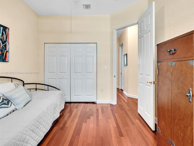 3230 SW 194th Ter, Miramar, FL 33029 - bedroom with wood finished floors, a closet, and baseboards