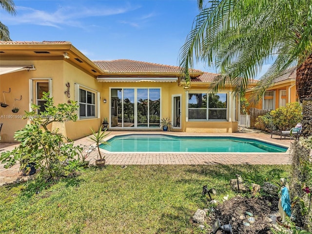 3230 SW 194th Ter, Miramar, FL 33029 - back of house featuring stucco siding, an outdoor pool, and a tile roof