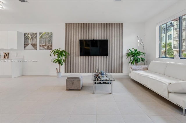 living room with light tile patterned floors
