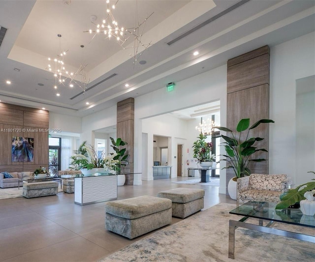 common area with a towering ceiling and recessed lighting