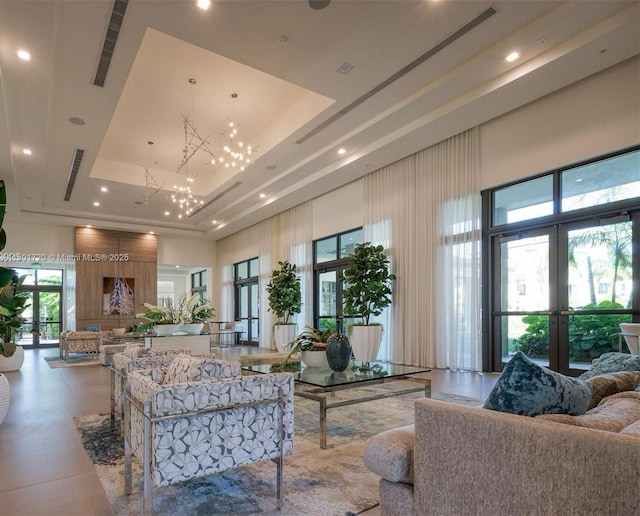 common area with a towering ceiling and recessed lighting