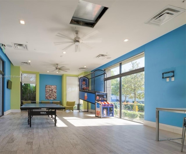 game room featuring wood finished floors, a ceiling fan, baseboards, and recessed lighting