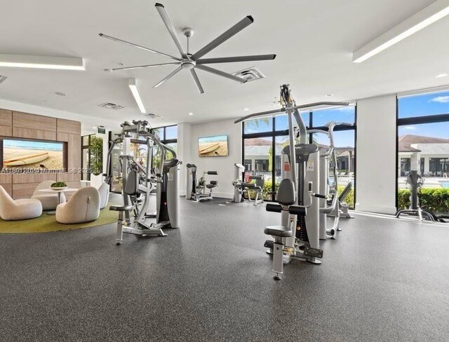 workout area with a ceiling fan