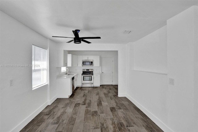 242 SW 9th St, Dania Beach, FL 33004 - unfurnished living room with a sink, ceiling fan, dark wood finished floors, and baseboards