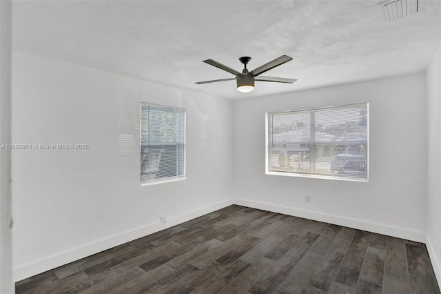 242 SW 9th St, Dania Beach, FL 33004 - empty room featuring dark wood-type flooring, a ceiling fan, and baseboards