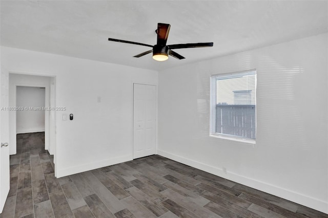 242 SW 9th St, Dania Beach, FL 33004 - unfurnished bedroom with dark wood finished floors, baseboards, a ceiling fan, and a closet