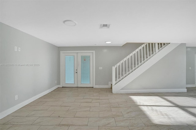 242 SW 9th St, Dania Beach, FL 33004 - entrance foyer with stairs, baseboards, and french doors