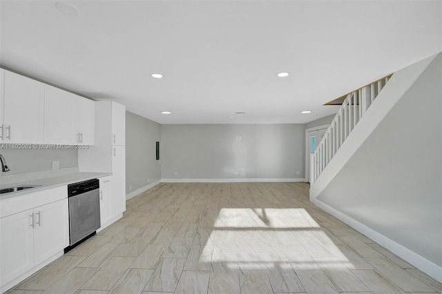 242 SW 9th St, Dania Beach, FL 33004 - kitchen featuring stainless steel dishwasher, light countertops, a sink, white cabinets, and recessed lighting
