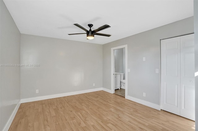242 SW 9th St, Dania Beach, FL 33004 - unfurnished bedroom with light wood-type flooring, baseboards, and connected bathroom
