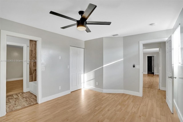 242 SW 9th St, Dania Beach, FL 33004 - unfurnished bedroom with light wood-style floors, baseboards, ceiling fan, and a closet