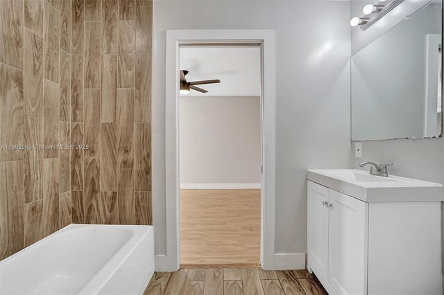 242 SW 9th St, Dania Beach, FL 33004 - bathroom with ceiling fan, vanity, tub / shower combination, and baseboards