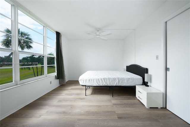 605 Oaks Dr Unit 203, Pompano Beach, FL 33069 - bedroom with light wood-style floors and a ceiling fan