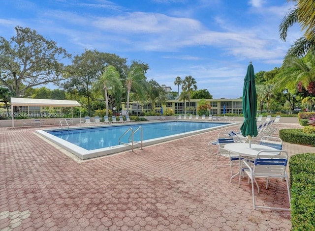605 Oaks Dr Unit 203, Pompano Beach, FL 33069 - community pool featuring a patio area