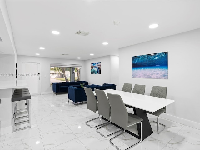 6820 SW 9th St, Pembroke Pines, FL 33023 - dining space with light marble finish flooring, baseboards, and recessed lighting