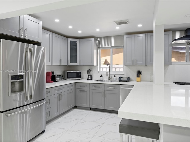 6820 SW 9th St, Pembroke Pines, FL 33023 - kitchen with appliances with stainless steel finishes, a sink, gray cabinets, light marble finish floors, and recessed lighting