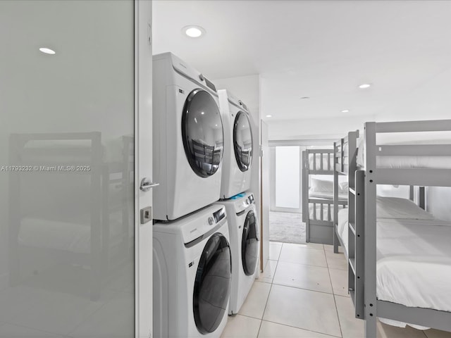 6820 SW 9th St, Pembroke Pines, FL 33023 - washroom with stacked washer / dryer, light tile patterned floors, and recessed lighting