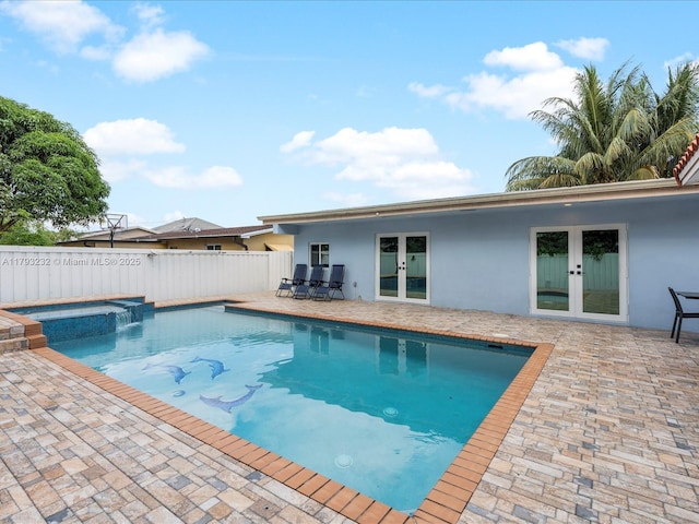 6820 SW 9th St, Pembroke Pines, FL 33023 - view of swimming pool with french doors, a patio, and a pool with connected hot tub
