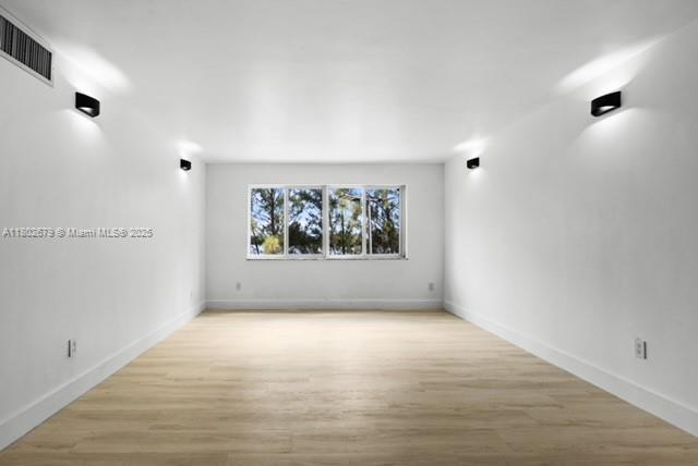 14840 Naranja Lakes Blvd Unit C4B, Homestead, FL 33032 - empty room featuring light wood-type flooring and baseboards